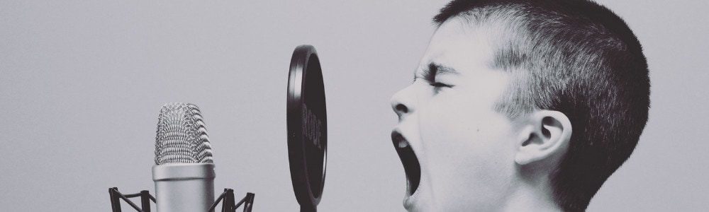 Boy shouting in the microphone